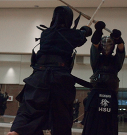 Two Kendo Students with Swords Overhead