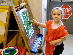 Child painting fishes
