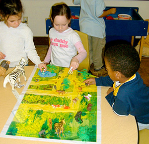Children with safari mat