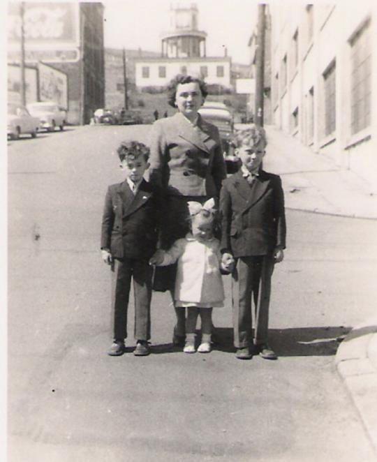 Siwiak family in Halifax, Nova Scotis, May 1956, with Citadel Hill and the Town Clock  vsible behind Them