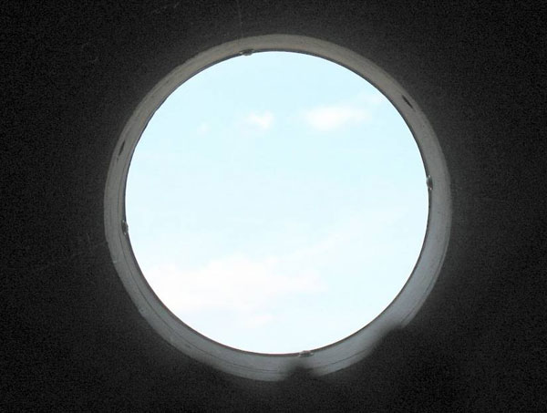 Looking up through the tube at the open sky
