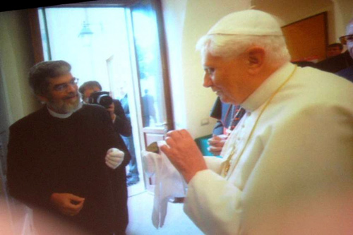 Brother Guy showing a piece of Martian meteorite to Pope Benedict XVI.