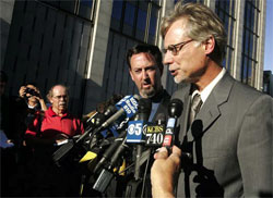 Lance Williams greets reporters after contempt charges
against him were dropped.