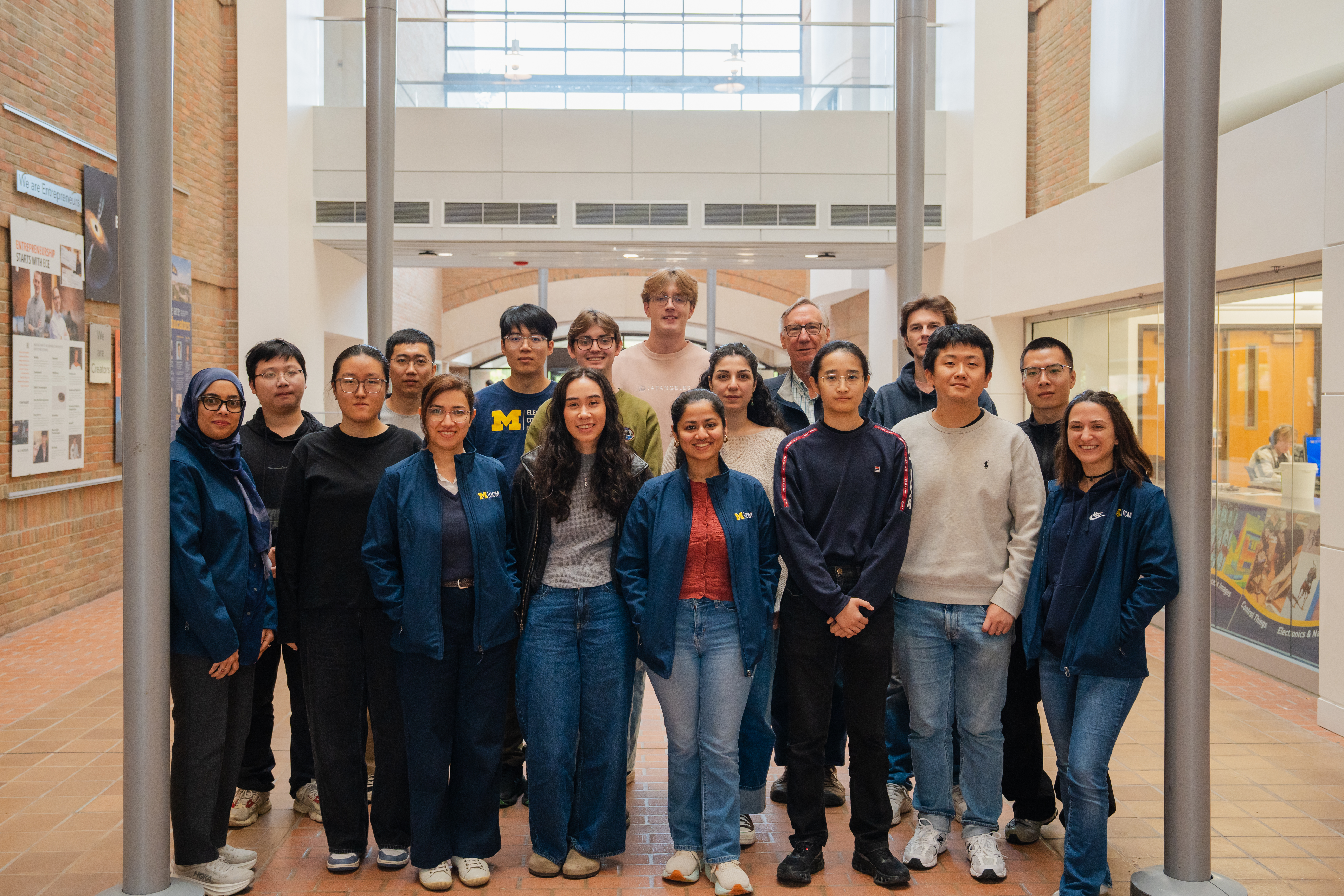 The OCM group in winter inside the atrium of  the EECS building.